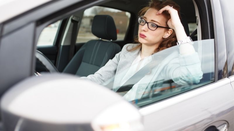 lady stuck in traffic wondering, are electric skateboards worth it?