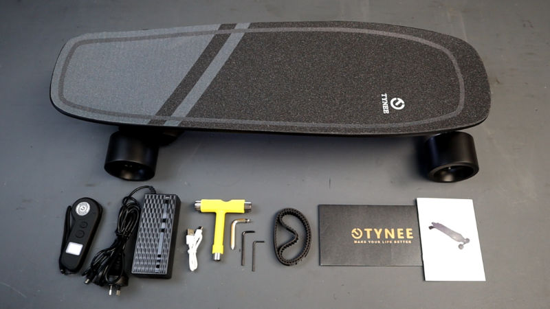 Box contents that comes with the Tynee Board Mini - remote, board charger, usb cable, t-tool, allen keys, belts, manual