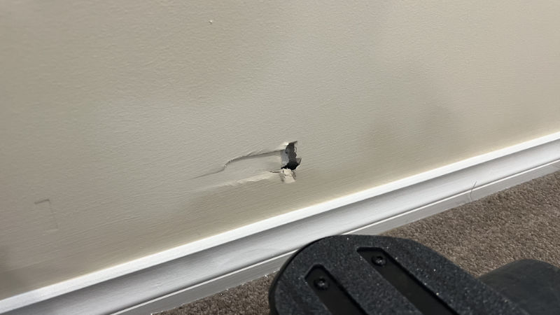 hole in wall from accelerating electric skateboard into it